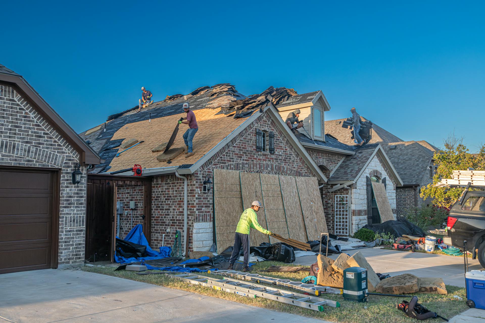 Roofing crew replacing a residential roof